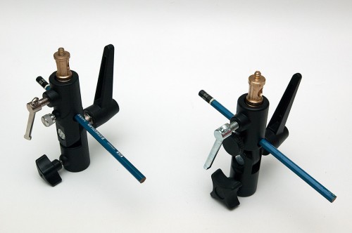 Illustrating using a pencil instead of diffuser umbrella. Meking Type H (Left) and Manfrotto 026 (Right). Illustrating that both adapters' umbrella holder hole are angled.