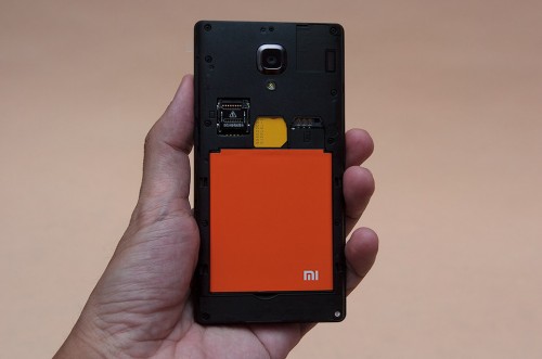 Loading in a 3G SIM card and the Lithium-ion battery to test the Redmi