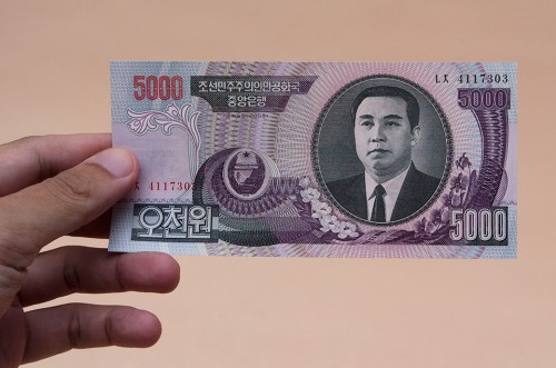 A printed note stating 5000 Korean Won