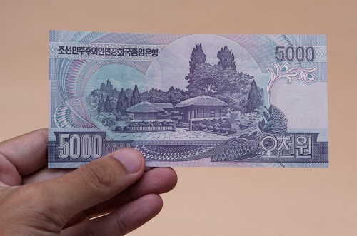 A printed note stating 5000 Korean Won